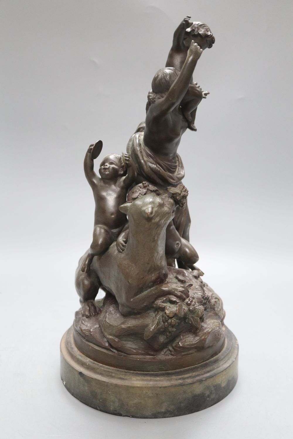 After Clodion. A bronze group of a mother, three putti and a panther, on naturalistic base and slate plinth, height 37.5cm